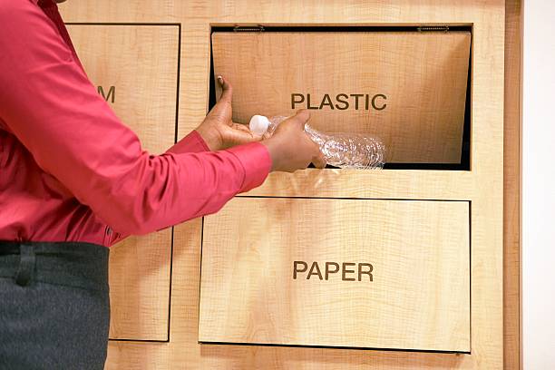 Woman recycling plastic