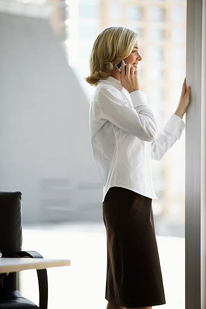 istock Businesswoman using a cell phone 517544792
