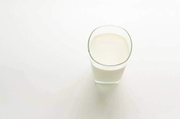 istock Cup of milk on white  table, concept for health 517545808