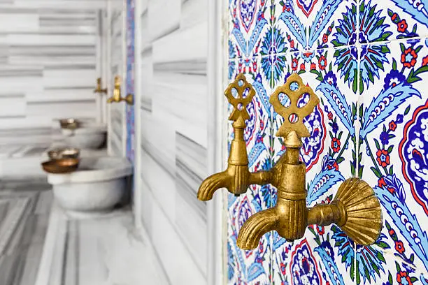 Traditional motifs and faucets in Turkish bath.