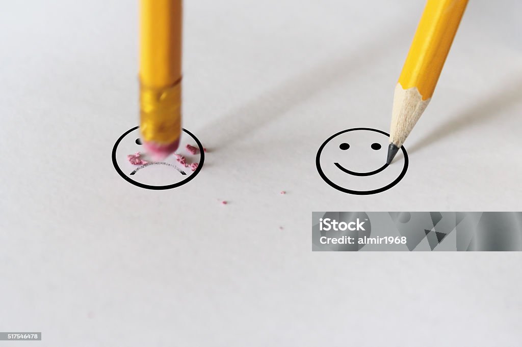 sadness to happiness sadness to happiness wit pencil eraser Negative Emotion Stock Photo