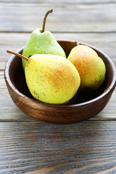 istock honey pears in a bowl 517547619