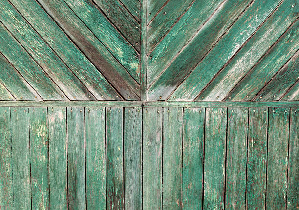 istock Vintage wooden door figured light green pattern. 517548218
