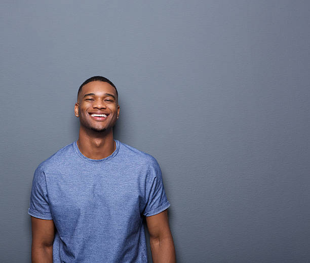 istock Cheerful young african american man 517548315