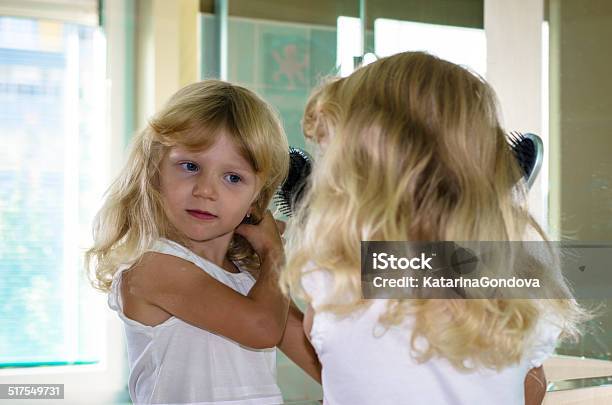 Blond Girl Brushing Hair Stock Photo - Download Image Now - Bathroom, Beautiful People, Beauty