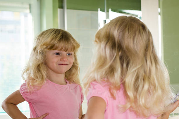 istock reflection of girl in the mirror 517549743