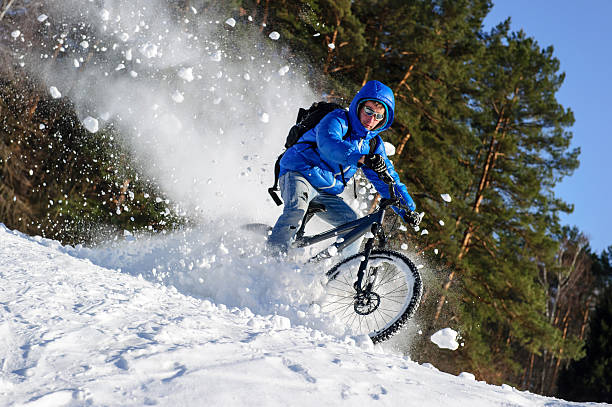istock Bicyclist riding snow 517550069