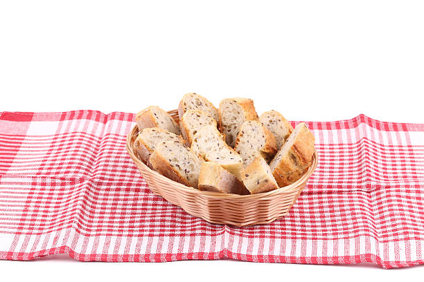 istock Sliced baguette on wicker basket. 517551357