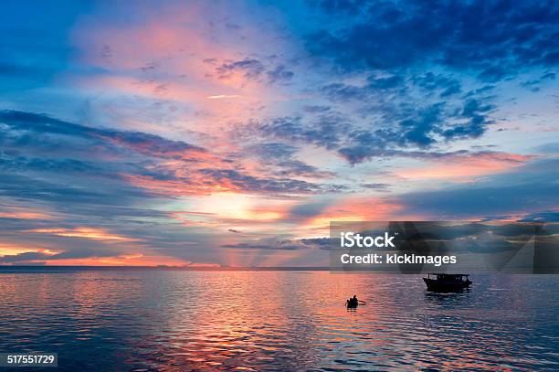 Sunset Boat Rowing Stock Photo - Download Image Now - Beauty In Nature, Cloud - Sky, Cloudscape