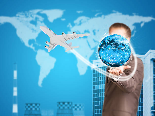 istock Businessman holding earth. Buildings as backdrop 517553089