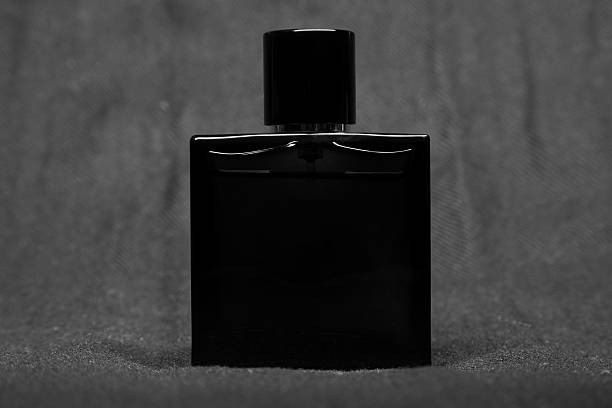istock Bottle of men perfume and gray scarf 517570784
