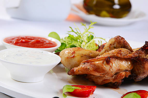 istock The baked hen with salad close-up 517570834