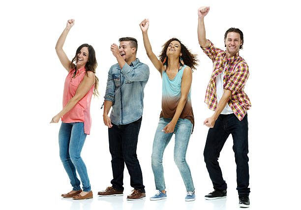 istock Four friends dancing together 517572448