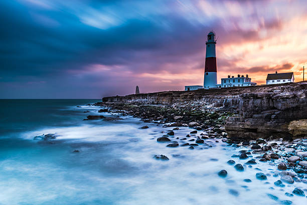 istock Time lapse of dramatic sunset and Portland Bill lighthouse 517572536