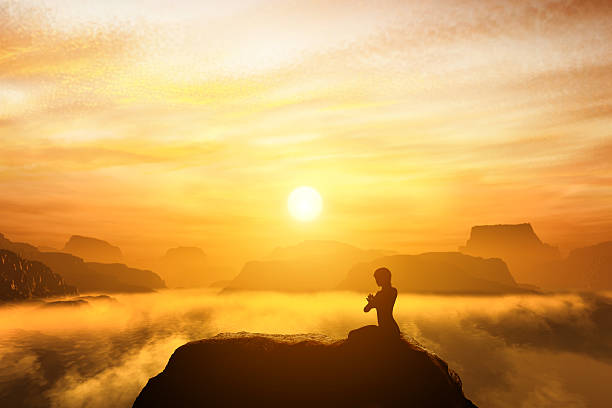 Woman meditating in sitting yoga position Woman meditating in sitting yoga position on the top of mountains above clouds at sunset. Zen, meditation, peace mantra stock pictures, royalty-free photos & images