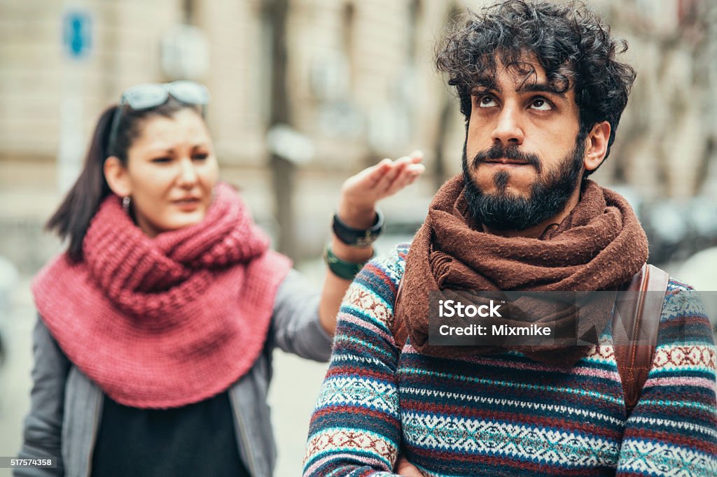 Relationship difficulties Interracial couple having fight on the street Communication Stock Photo