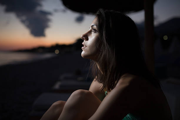 Watching ocean,sea horizon with a Moon eclipse.Stargazing,Sun Eclipse.Moonlight.Sunrise Woman watching the ocean,sea horizon with a Moon on the sky.Eclipse of the Moon.Eclipse of the sun.Stargazing,watching stars on the beach under the moonlight.Enjoying summer nights.Night sky.Sunrise eclipse photos stock pictures, royalty-free photos & images