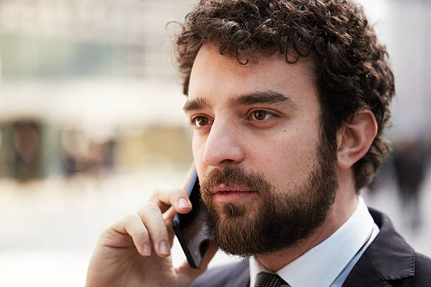 istock businessman talking to mobile 517574694