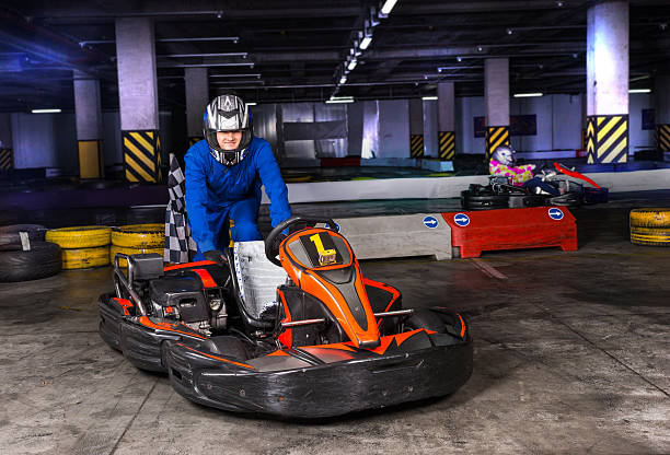 istock Bumper car driver in blue jumper leans on his ride 517576954