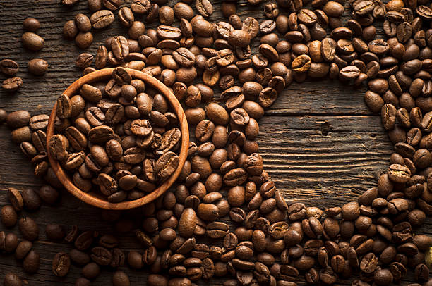 istock Coffee cup and saucer on a wooden table. Dark background. 517578120