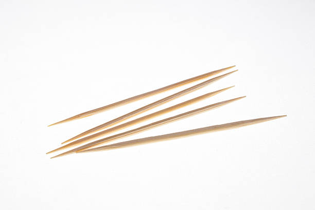 The toothpick. The small-sharp woods, used to clean teeth. toothpick stock pictures, royalty-free photos & images