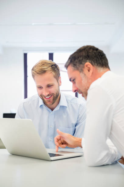 istock Businessmen Working On Laptop In Office 517578301
