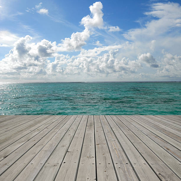 istock Tropical seascape with empty wooden platform 517579265