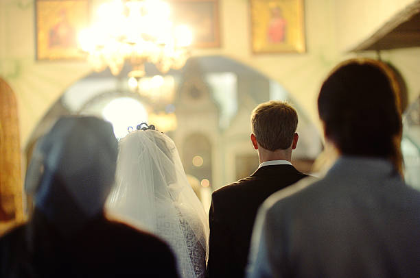 istock Wedding couple in a church 517580541
