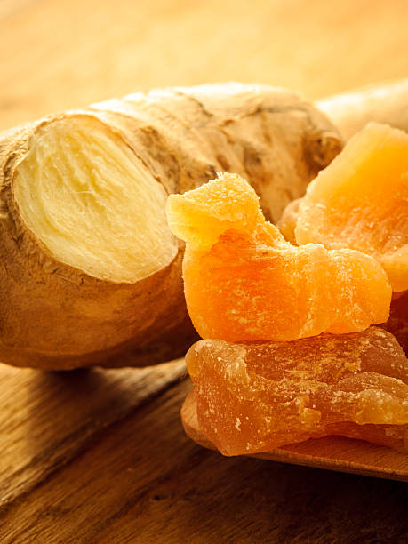 istock Closeup root and candied ginger on wooden table 517581585