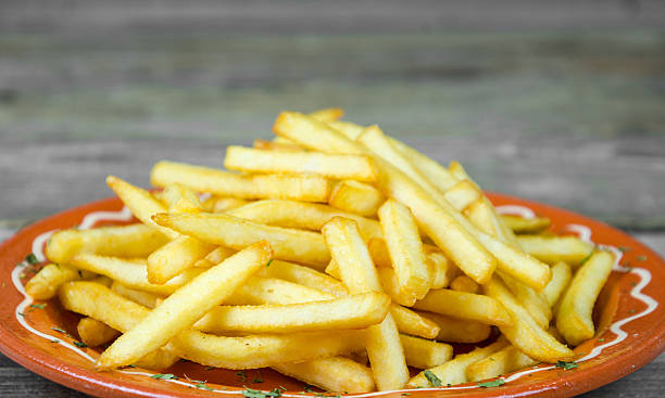 istock French fries on a clay accurate 517582166