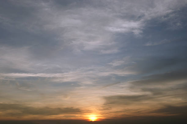 istock Evening sunset with cloudy skies 517583316