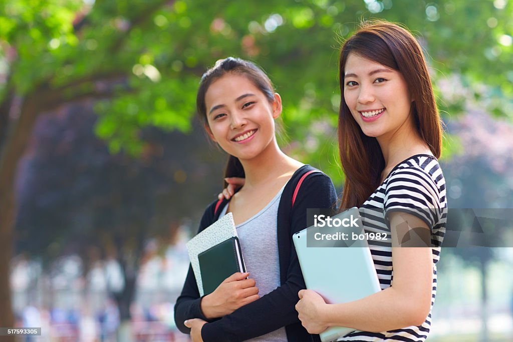 two female asian college students in campus two happy female asian college students in campus 20-24 Years Stock Photo