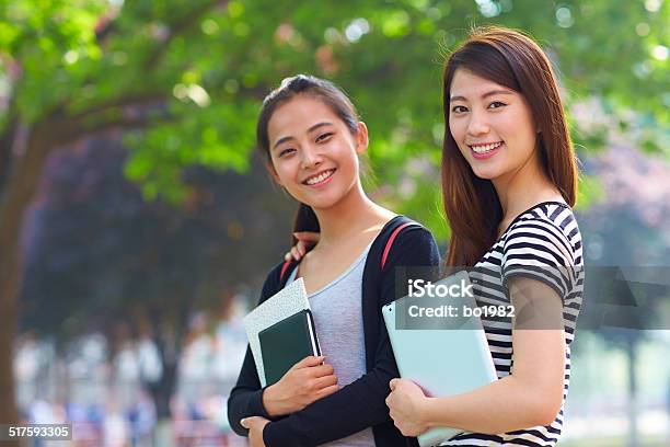 Two Female Asian College Students In Campus Stock Photo - Download Image Now - 20-24 Years, Adult, Adults Only