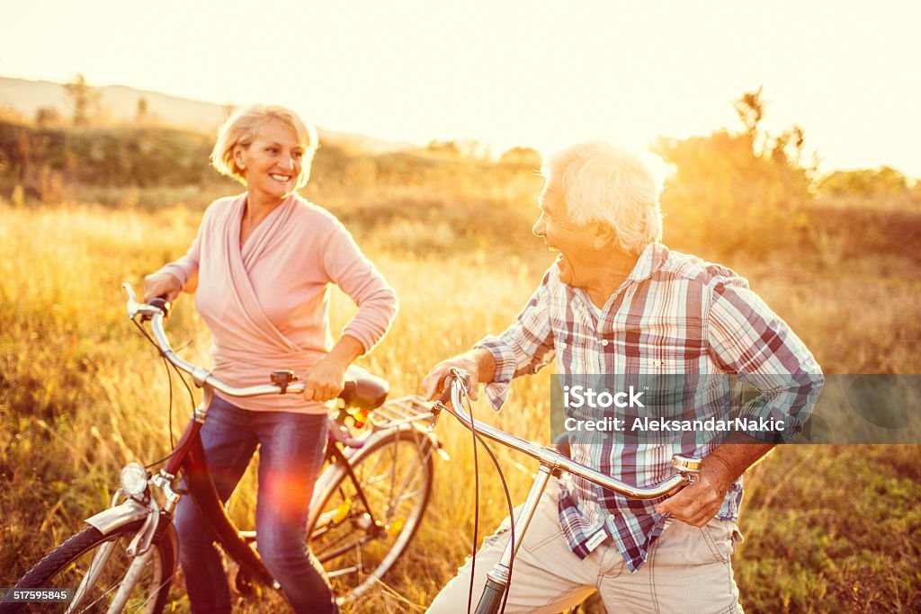 Smiling senior couple riding bicycles Smiling senior couple riding bicycles  Bicycle Stock Photo