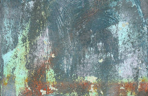 istock brute blue red painted worn metal with some rust 517597765