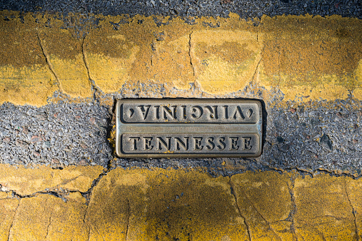 The Virginia-Tennessee state line is marked between the double yellow line on State Street in downtown Bristol
