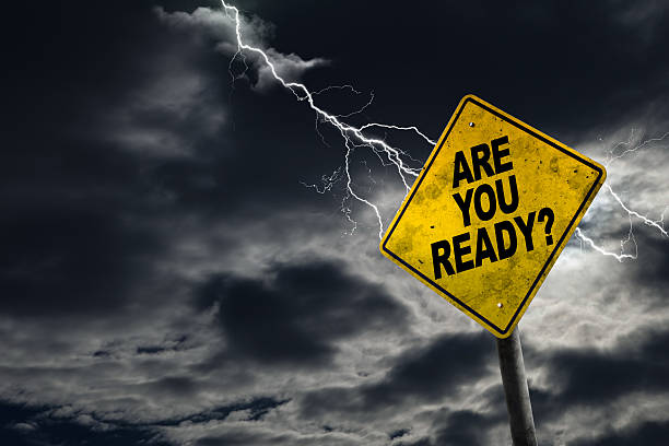 Are You Ready Sign With Stormy Background Are You Ready sign against a stormy background with lightning and copy space. Dirty and angled sign adds to the drama. weather warning sign stock pictures, royalty-free photos & images