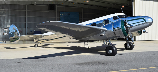 Vintage, silver-colored, all-metal airplane popular as an airliner in the 1930s.