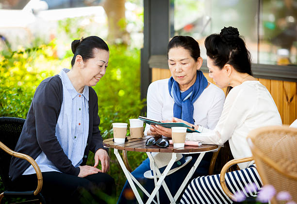 istock Elderly Ladies Viewing Photos Using Digital Tablet 517599094
