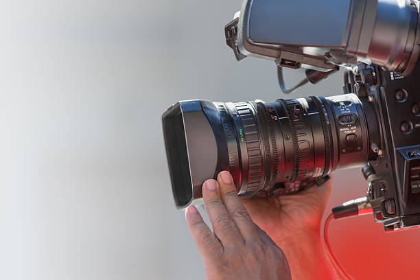 istock Close up cameraman at work outdoors 517599550