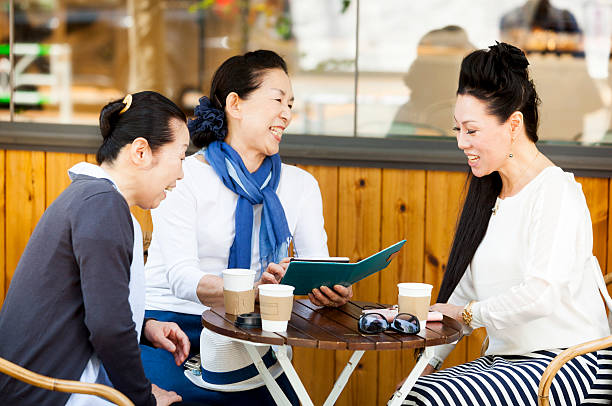 istock Elderly Ladies Reflecting On Joyful Memories In Outdoors Cafe 517599562
