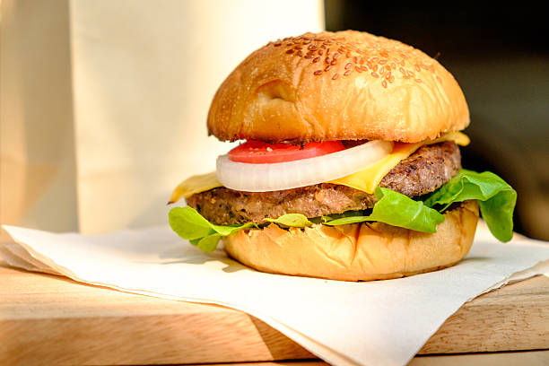 istock Yummy Beef and cheese Hamburger place on wood tray 517603242