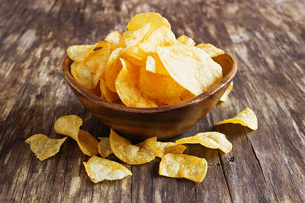 istock Potato chips in a wooden bowl 517603572