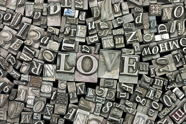 Close up of typeset letters with the word Love stock photo