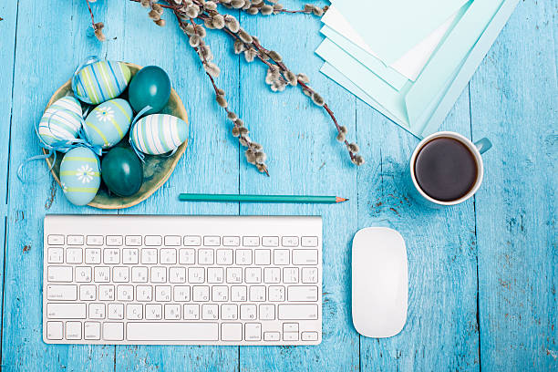 istock The top view of easter on wooden table office workplace 517605512