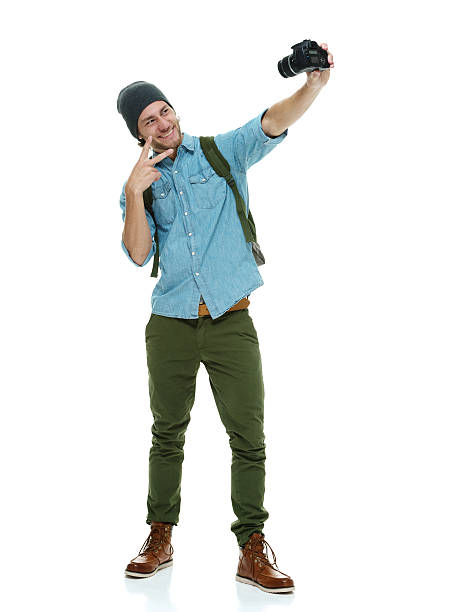 istock Smiling photographer taking a selfie 517605542
