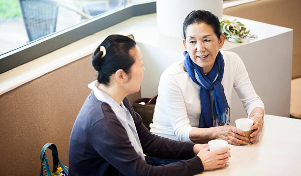 istock Two Elderly Asian Women Chatting In A Cafeteria 517606004