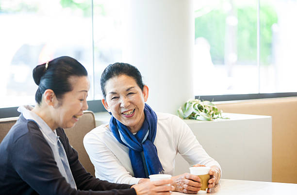 istock Two Asian Elderly Women In A Cafeteria In Summer 517606054