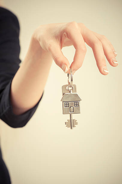 istock Woman Holding House Keys 517606496
