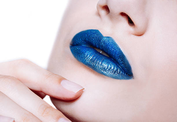 istock Woman lips with glossy blue lipstick 517606746